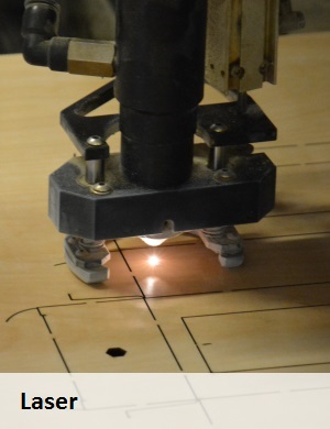 Formes de découpe laser, laser en train de découper.
